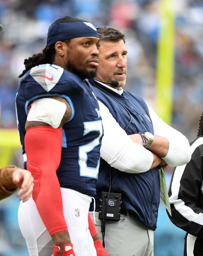 Nov 26, 2023; Nashville, Tennessee, USA; Tennessee Titans head coach Mike Vrabel running back Derrick Henry (22) watch as officials review a play during the first half against the Carolina Panthers at Nissan Stadium.